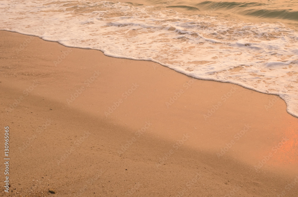 Copy space of smooth wave beach and sand texture background.