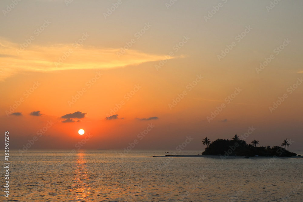 Sunset on Maldives island with little island.Low key. Sunset on Maldives island with little island.Low key.