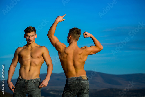 Handsome twin men or bodybuilders