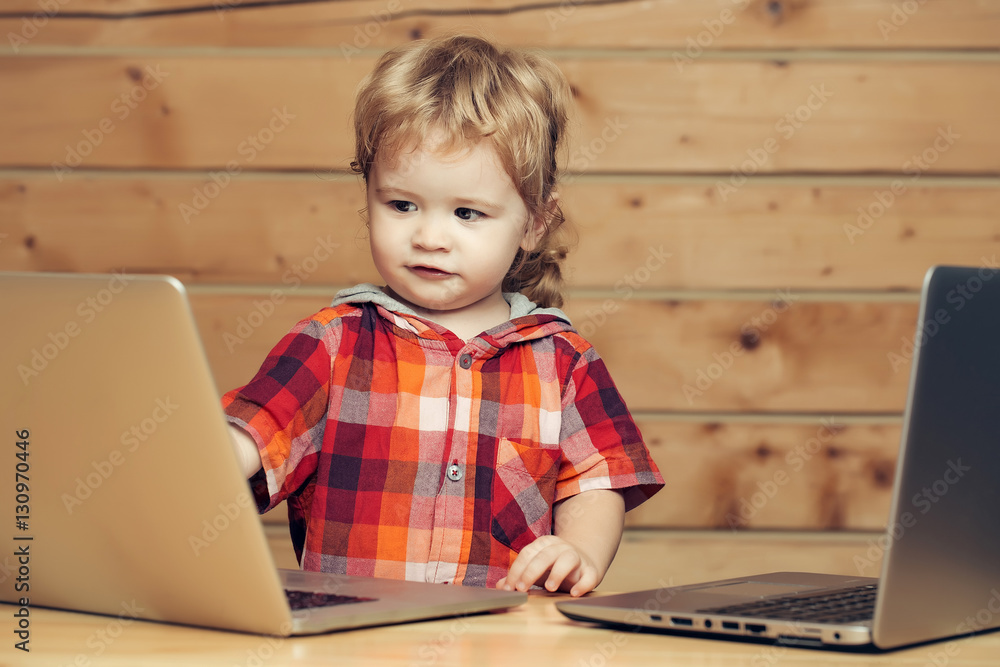 Cute boy plays on computers Cute boy plays on computers