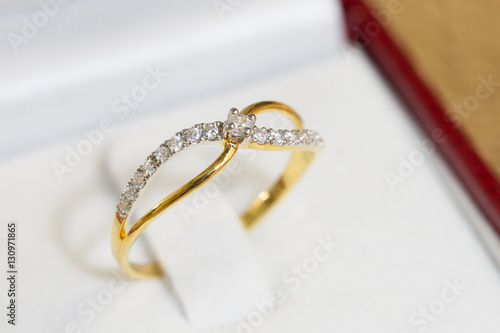 Diamond ring, gold body on white base