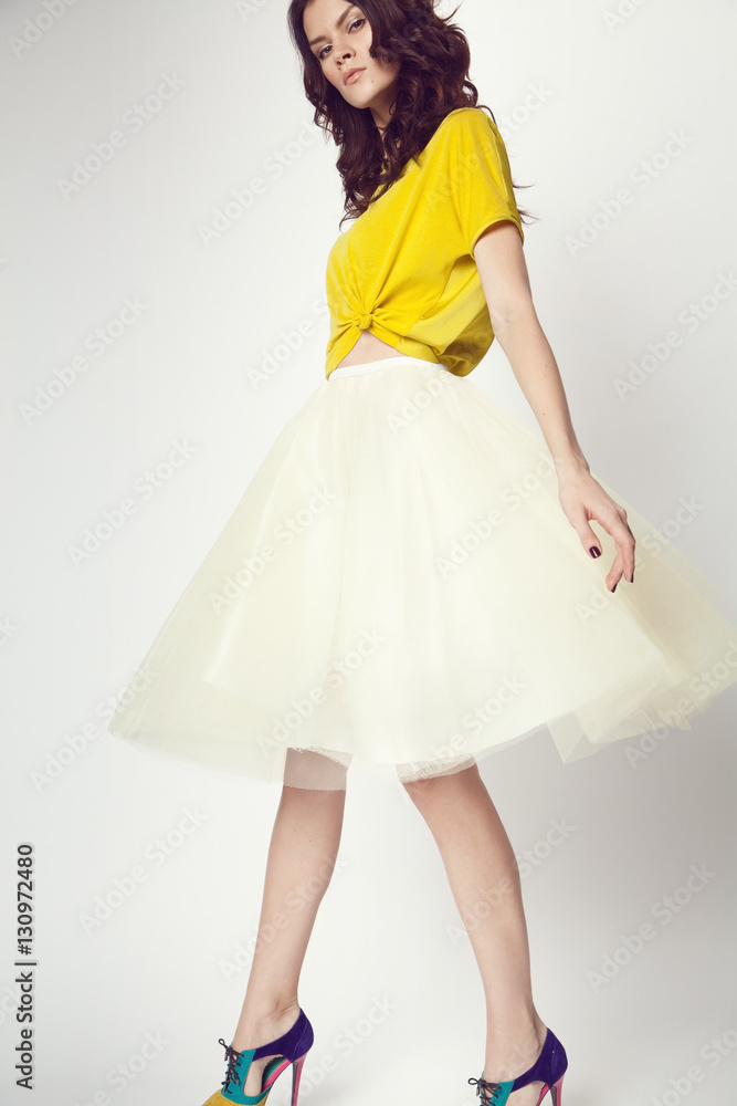 woman in yellow shirt and white skirt woman in yellow shirt and white skirt