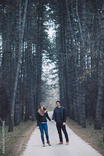 Loving couple in forest. Happy couple in love posing outdoor.