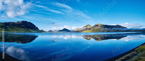 panoramic picture of Alftavatn Lake coast with mountain reflection at the sunrise, Iceland.