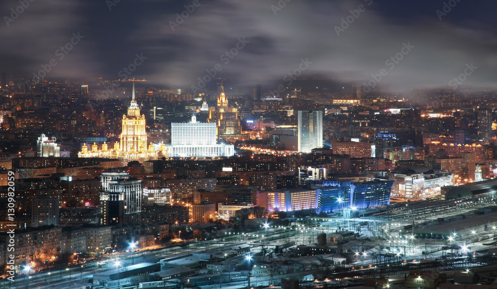 Fototapeta premium View from the roof tops in the winter on night city Moscow.