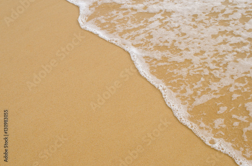 Copy space of smooth wave beach and sand texture background.