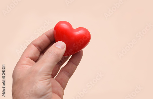 Fototapeta Naklejka Na Ścianę i Meble -  Red healthy heart in hand