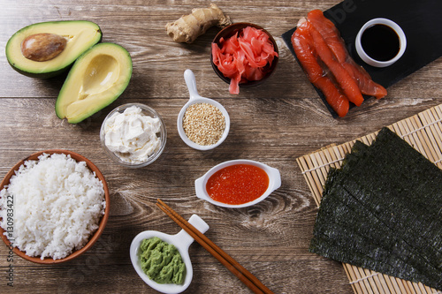 ingredients for sushi on a wooden table photo