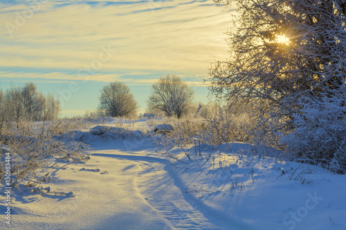 Winter snow landscape with sky and Sun © Amikphoto
