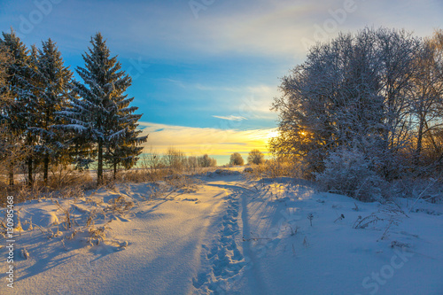 Winter snow landscape with sky and Sun