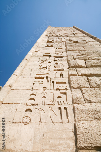 wall of landmark Egyptian mortuary Temple of Ramses or Ramesses III at Medinet Habu, monument with carving figures and hieroglyphs, in Luxor, Egypt, Africa
 photo