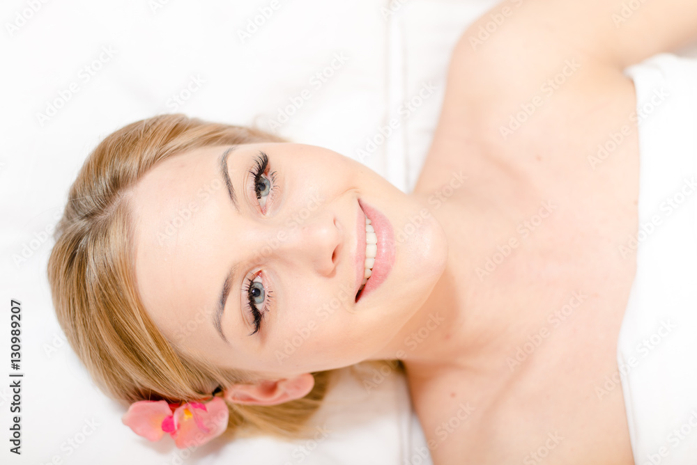 Portrait pretty woman during spa massage procedures in salon Portrait pretty woman during spa massage procedures in salon