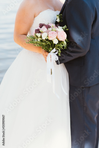 bride and groom on the background of the river