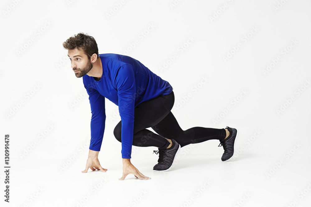 Athlete crouching and ready to run Athlete crouching and ready to run