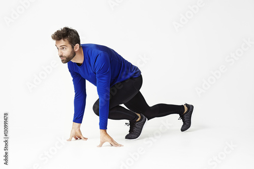 Athlete crouching and ready to run