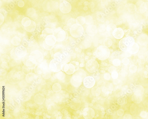 Abstract whtie bokeh on yellow background.