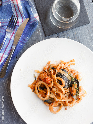 Traditional italian seafood pasta with calamari and mussel