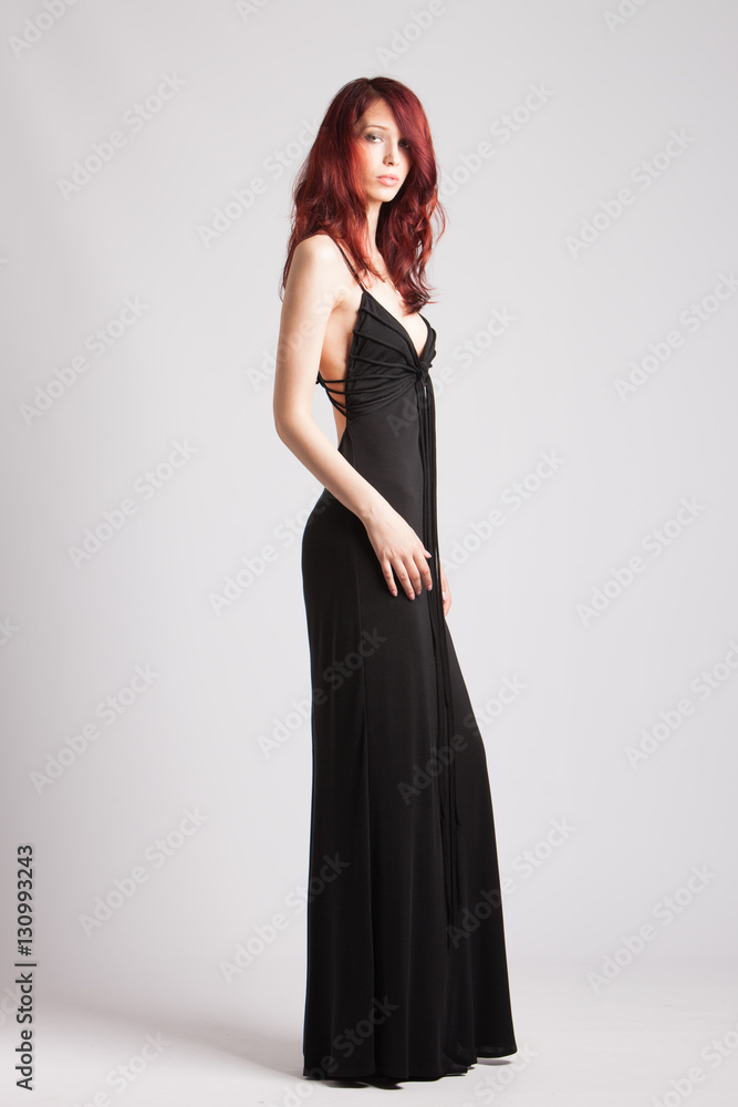 red-haired girl in long evening black dress red-haired girl in long evening black dress