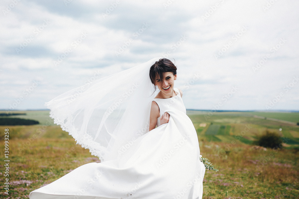 The bride with bouquet stand on the stones The bride with bouquet stand on the stones