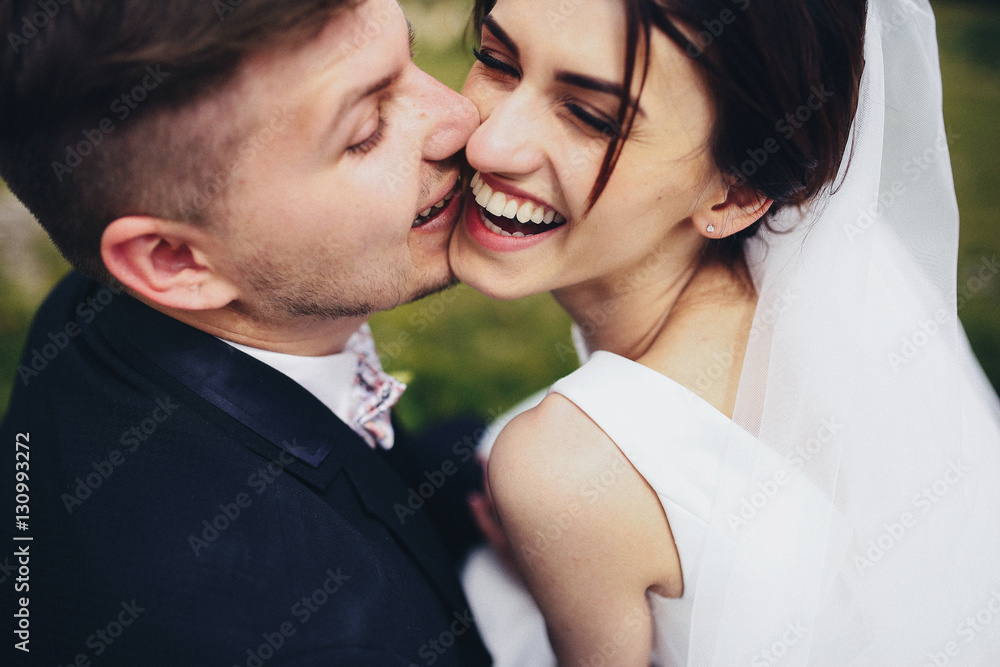 The groom kissing his bride The groom kissing his bride