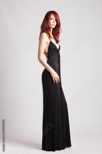 red-haired girl in long evening black dress