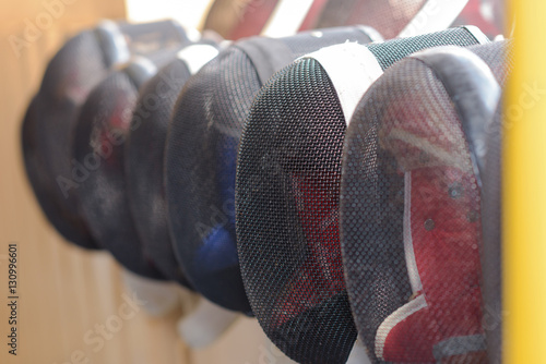 Foto fencing masks hanging
