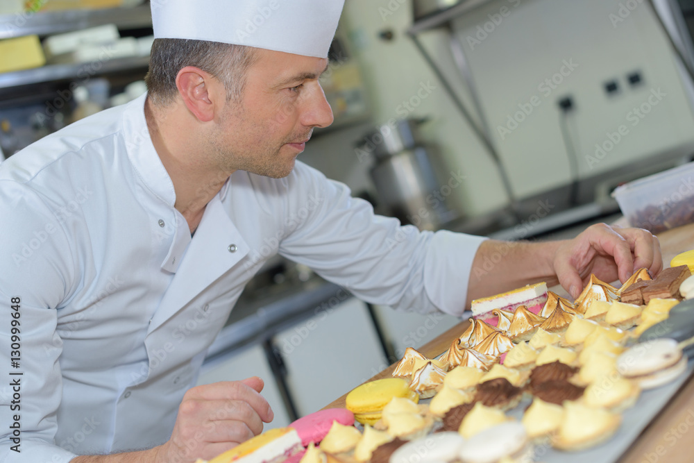 placing the sweets on the tray placing the sweets on the tray