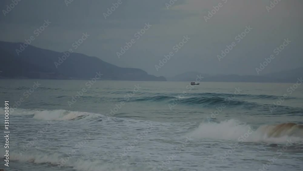 Sea waves fishing boats Mountain View. deserted beach Sea waves fishing boats Mountain View. deserted beach