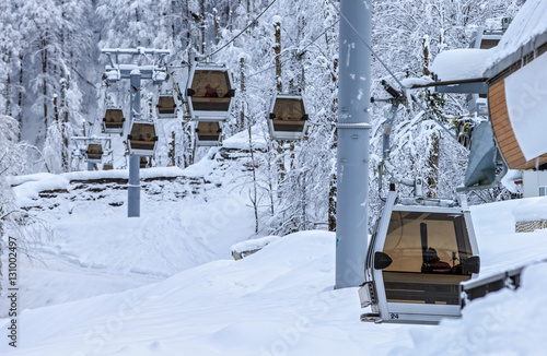 Wallpaper Mural Cableway ski cabin lift line of a ski mountain resort on snowy winter mountain forest background. Beautiful scenic landscape Torontodigital.ca