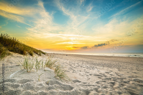 Sand dunes against the sunset light on the beach in northern Poland photo