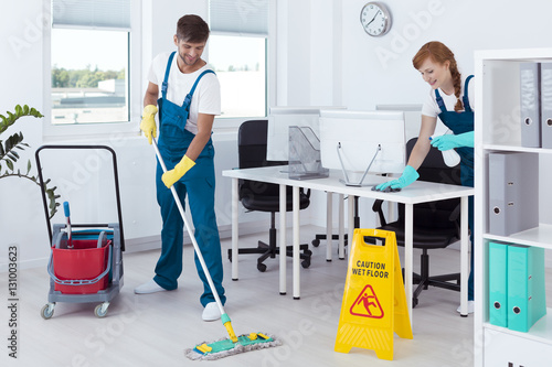 Cleaners working in uniforms