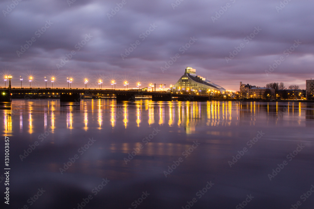 Cosmopolitan night cityscape of Baltic riverside in Riga, Latvia