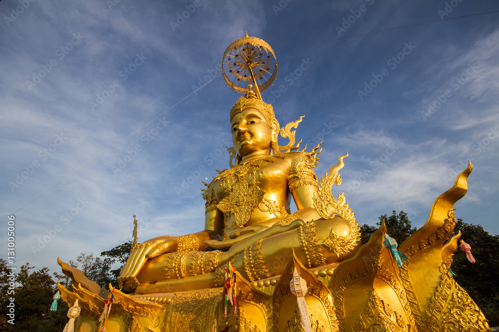 Golden Buddha Image with blue sky