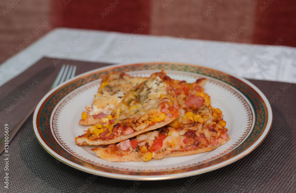 Homemade pizza on a plate Homemade pizza on a plate