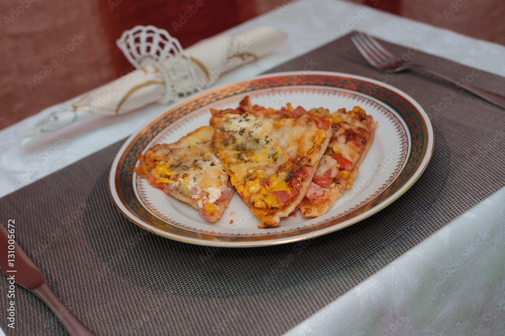 Homemade pizza on a plate Homemade pizza on a plate