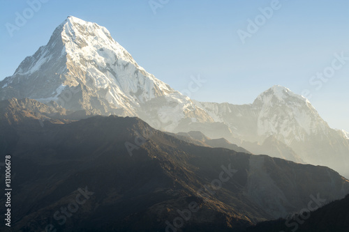 Mountain peak with morning light in blue sky background
