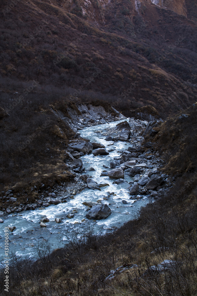 Stream with ice flowing down from the mountains Stream with ice flowing down from the mountains
