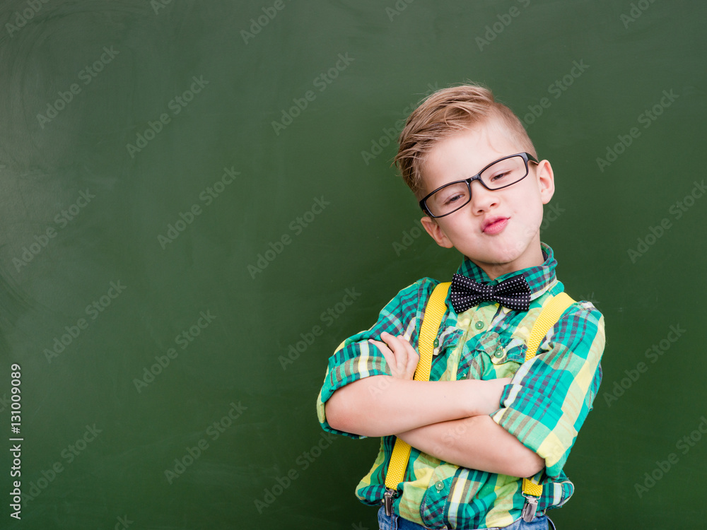 Funny happy nerd near empty green chalkboard Funny happy nerd near empty green chalkboard
