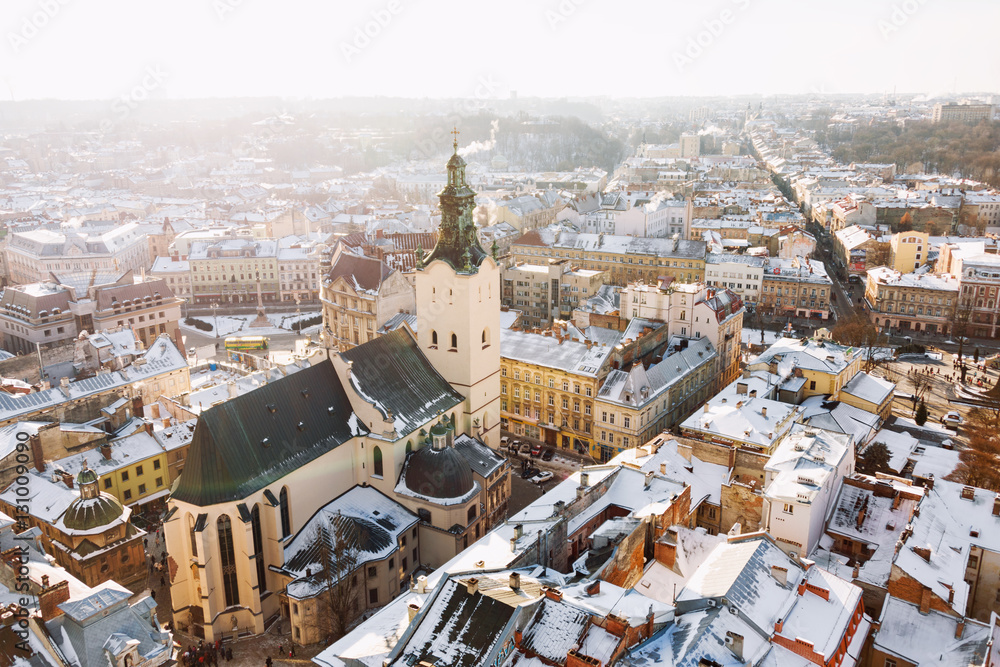 Winter panorama view from the Town Hall on the downtown in Lviv, Ukraine. Old buildings. Roofs covered with snow.
