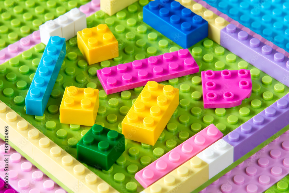 Baseplate with colorful plastic building blocks Baseplate with colorful plastic building blocks
