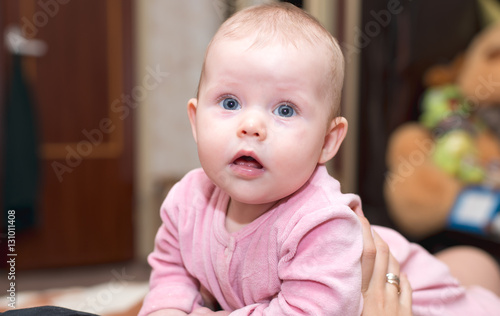 Baby with blue eyes looking at the camera