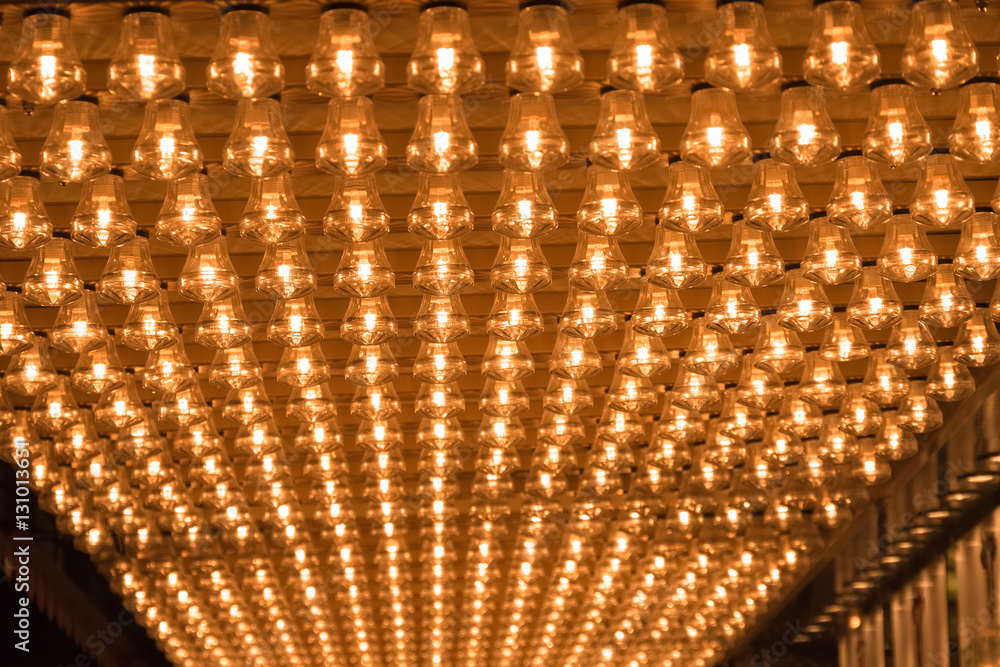 Fotografie Ceiling covered in filament light bulbs for background use