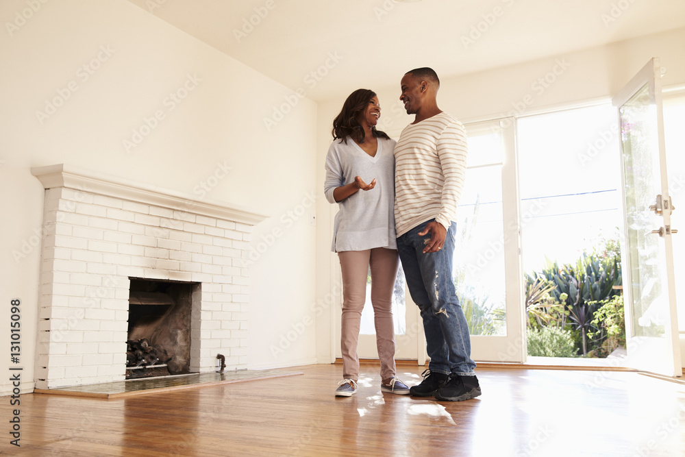 Excited Couple Explore New Home On Moving Day Excited Couple Explore New Home On Moving Day