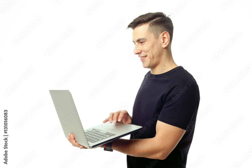 Portrait of smiling young man with laptop isolated Portrait of smiling young man with laptop isolated