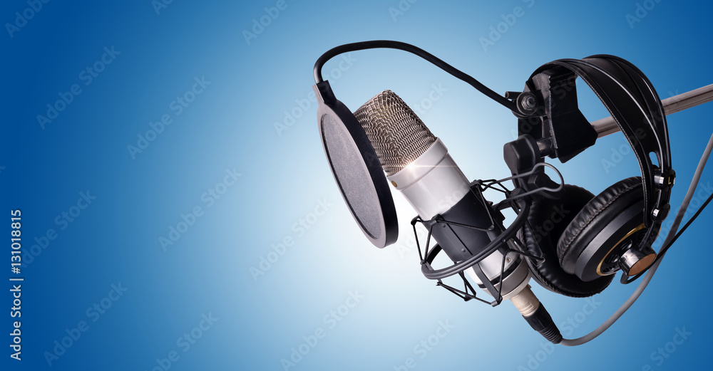Fotografie Studio condenser microphone and equipment blue isolated