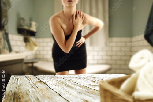 wooden shelf and woman in bathroom 