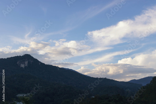 Fototapeta Naklejka Na Ścianę i Meble -  High mountains, white clouds and blue sky landscape.