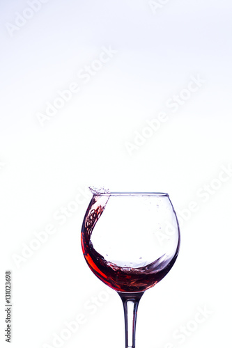 Wine splashing in glass
