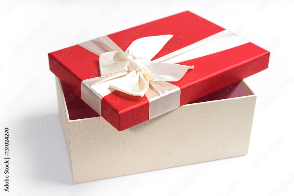 Fototapeta premium Red gift box with white ribbon isolated on white background. 