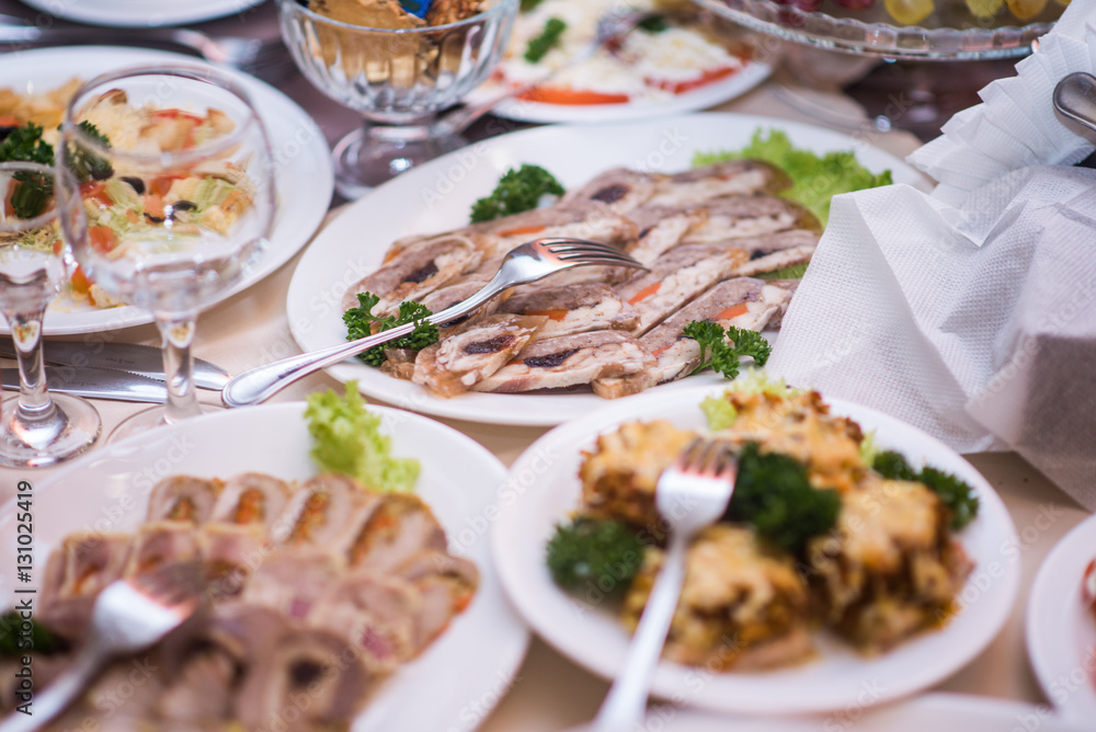Lots appetizers on a table in a restaurant Lots appetizers on a table in a restaurant